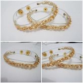 Pulseira em transparência e corrente dourada